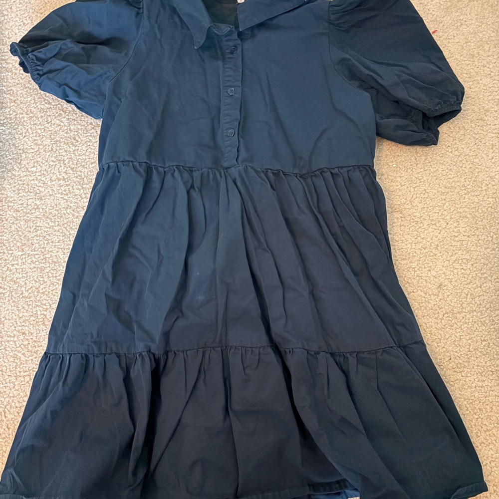 Navy blue dress with puffy sleeves and ruffles